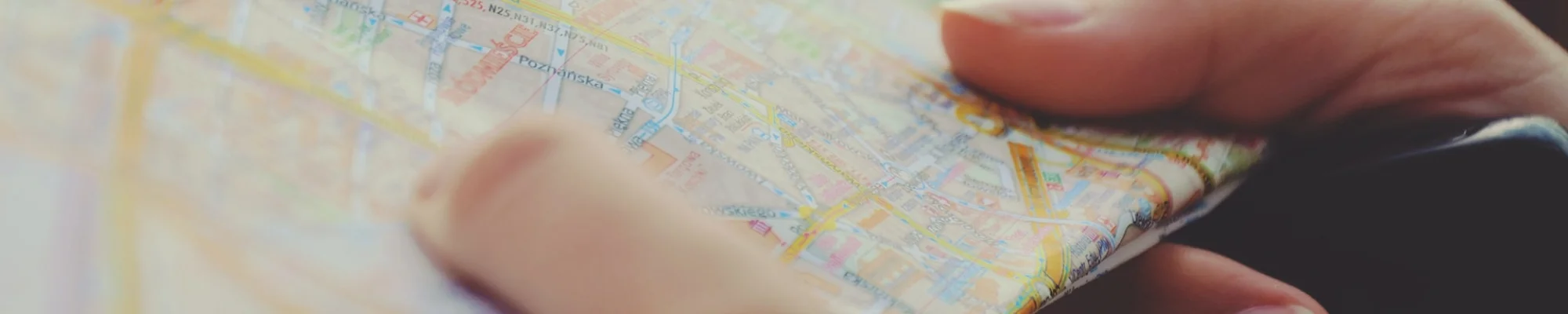 person holding a map in their hands