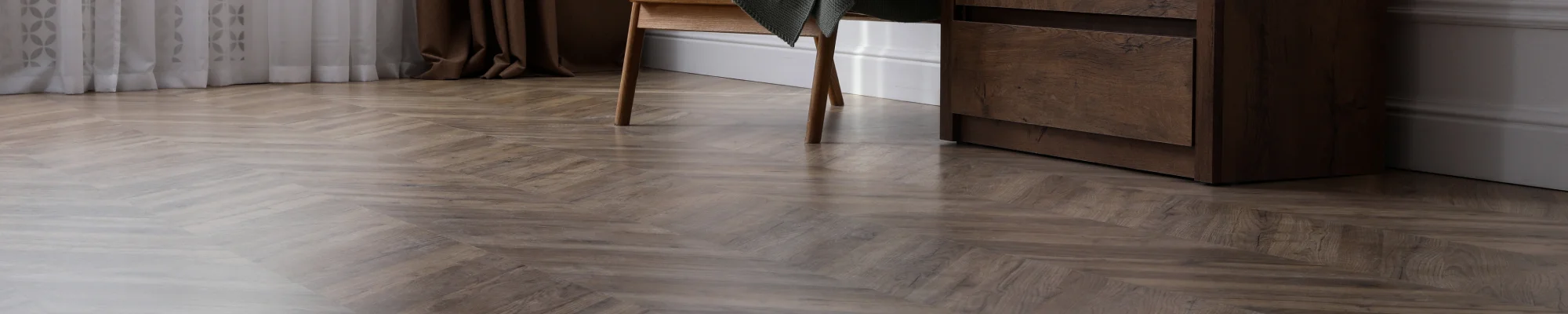 dark and elegant hardwood floors installed in a herringbone pattern